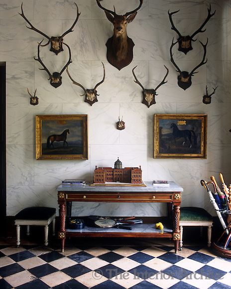 Sets of antlers are dsiplayed on the marbleised wall of the entrance hall ~ Chateau de Groussay, photo by Christopher Simon Sykes Deer Heads, Antler Wall, Hunting Room, Trophy Rooms, The Enchanted Home, Casas Coloniales, Enchanted Home, Lodge Decor, Entrance Hall