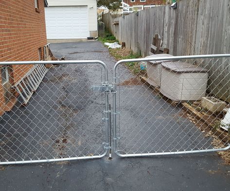 Dog-Proof Chain Link Fence Double Gate Latch Double Gate Latch Ideas, Gate Lock Ideas, Painted Chain Link Fence, Gate Latch Ideas, Fence Double Gate, Dog Proof Fence, Chain Link Fence Installation, Chain Link Fence Gate, Chain Fence