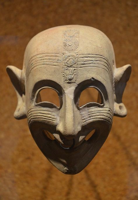 Phoenician grinning mask, 4th century BCE, found in a grave at San Sperate in Sardinia. Masks like these were used to ward off evil. (Cagliari Museo Archeologico Nazionale) Phoenician Jewelry, Ancient Mask, Ancient Carthage, Punic Wars, African Ancestry, Sculptures Céramiques, Guy Fawkes, Carthage, Masks Art