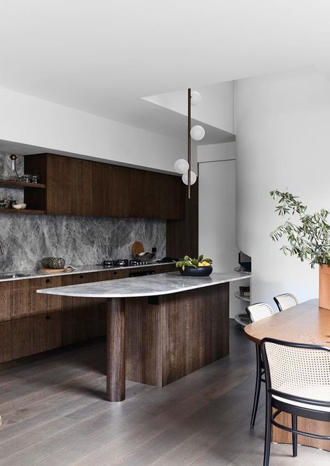 Dark Timber Interior, Stone Kitchen Island Backsplash, Dark Timber Kitchen, Curved Island Bench, Dark Kitchens, Stone Kitchen Island, Curved Kitchen Island, Luxury Kitchen Island, Street Townhouse