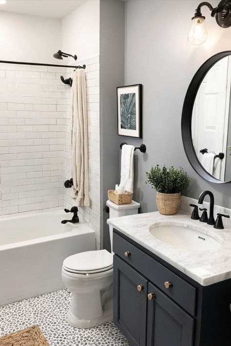 Get that high-end look without the designer price tag! These clever updates will give your bathroom an upscale feel without breaking the bank. From affordable tile alternatives to DIY upgrades, create luxury for less! #BudgetDecor #LuxuryForLess #BathroomUpdates Guest Bathroom With Tub Ideas, Small Bathroom With Black Cabinets, Townhouse Bathroom Ideas, Bathroom Remodel Before And After, Condo Bathroom Ideas, Builder Grade Bathroom Makeover, Small Bathroom Designs With Bathtub, Master Bath Update, Tile Alternatives