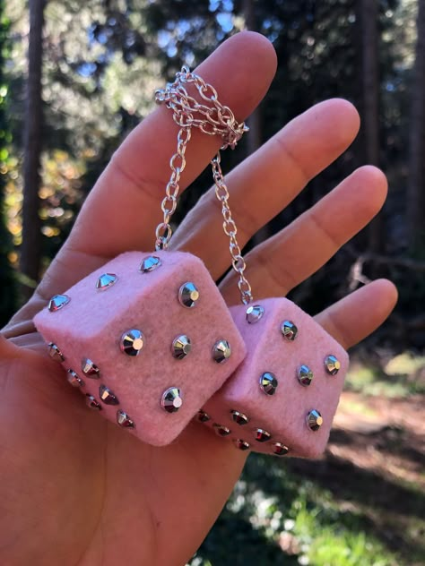 "Item available is a nice new set of Baby Pink Fuzzy Dice with Silver Chrome Gems. Other bling gem colors available. For a car or truck. Strong assembly, attaches to a standard car or truck mirror. Pieces measure approx. 1.38 x 1.38 x 1.38 inches. Made of solid maple wood, metal, and fabric. Approx. 13\" long chain. Nylon cord also available as variation. Works great if wrapped twice around mirror. Hand made with pride in U.S.A. You will receive an item in stock. Thanks and good luck on this one!" Mazda Car Accessories, 90s Car Accessories, Cute Car Things, Pink Fuzzy Dice, Cute Cars Accessories, Car Accessories Pink, Diy Car Accessories, Car Dice, Fuzzy Dice