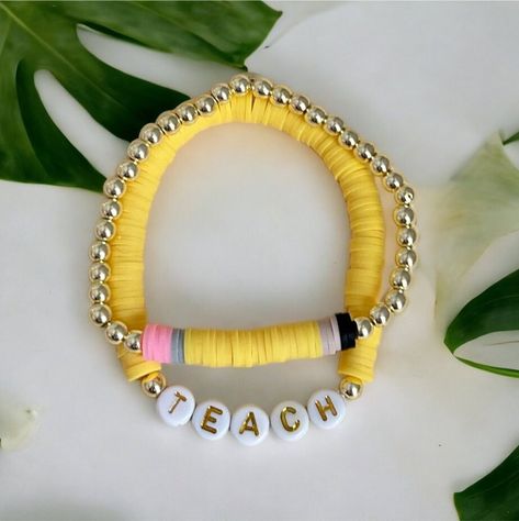 This set is the cutest as a teacher appreciation, teacher holiday or teacher birthday gift! It is also perfect with a child's name or inspirational word for the first day of school!  Listing includes BOTH bracelets pictured.  -Please add your bracelet size in the drop down menu.   -Please include all personalization requests in the text box. Made with: Polymer clay, acrylic letter beads and 14k gold plated beads on high quality elastic jewelry cord -All orders are FINAL SALE. These are custom bracelets made to order.   -PLEASE DOUBLE CHECK ALL COLOR, SIZE, AND LETTER SELECTIONS PRIOR TO CHECKOUT. -Each order will arrive in an organza bag unless gift wrap option is added to your cart  -Child Sizing    *These are available in child sizes. Please review the size chart if you need help determi Teacher Clay Bead Bracelet Ideas, Teacher Bracelet Ideas, Jewelry To Make And Sell, Teacher Polymer Clay, Elastic Jewelry, Beaded Name Bracelet, Teacher Bracelet, Teacher Gift Back To School, Teacher Jewelry