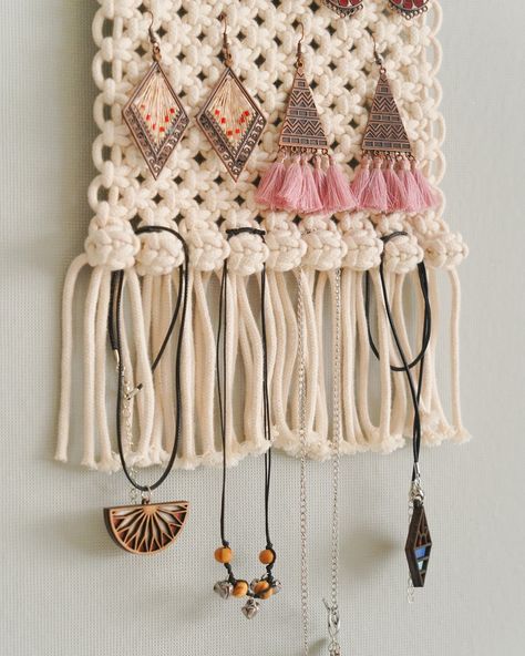 🌟Looking for a special gift for the wonderful woman in your life or perhaps treating yourself to something truly unique? Our Macrame Jewelry Holder will be the perfect fusion of artistry and functionality, elevating any space with its rustic sophistication and timeless allure. 💎 ✨ Discover these heartfelt creations at https://beandaikon.etsy.com/listing/1650250904 or reach out to us directly. #homeinspiration #macramedecor #bohemianstyle #artisanalcrafts #homestyling #bohoart #selflove #fem... Macrame Jewelry Holder, Cord Wood, Accessory Storage, Christmas Organization, Jewelry Hanger, Macrame Wall Art, Boho Macrame, Boho Accessories, Macrame Decor