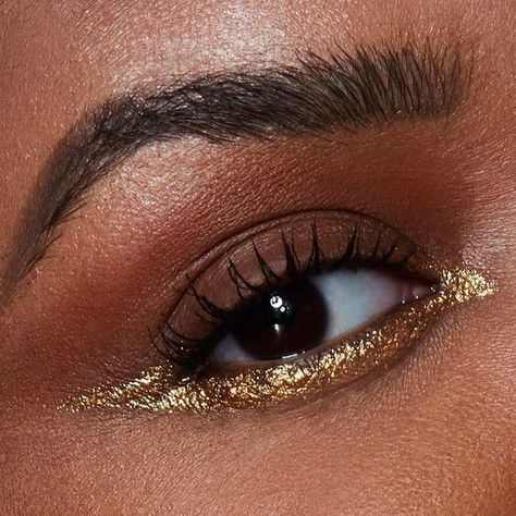 4 Festive Eyeliner Looks to Try This Holiday Season    | Makeup.com by L'Oréal Gold Eyeliner Looks, Copper Eyeliner, Anniversary Makeup, Makeup For Round Eyes, Abstract Eyes, Abstract Makeup, Christmas Party Makeup, Holiday Shoot, Evening Eye Makeup