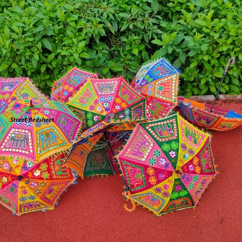 https://www.etsy.com/listing/1748058168/wholesale-lot-indian-umbrella-for?click_key=f82511c3f82e5e4e319d93c33703280121e8c387%3A1748058168&click_sum=d417bb8b&ref=shop_home_active_2&pro=1&frs=1#rainy #fashion #sky #instagram #photo #beautiful #downpour #picoftheday #ig #rainbow #gloomy #city #re #beach #d #biohazard #rihanna #payung #umbrellacorporation #bnw #beauty #regenschirm #paraguas #weather #sun #design #fun #travelphotography #life #cute Indian Umbrella, Decorative Umbrella, Mango Flower, Folding Canopy, Parasol Wedding, Sun Parasol, Umbrella Decorations, Bohemian Quilt, Christmas Gift Items