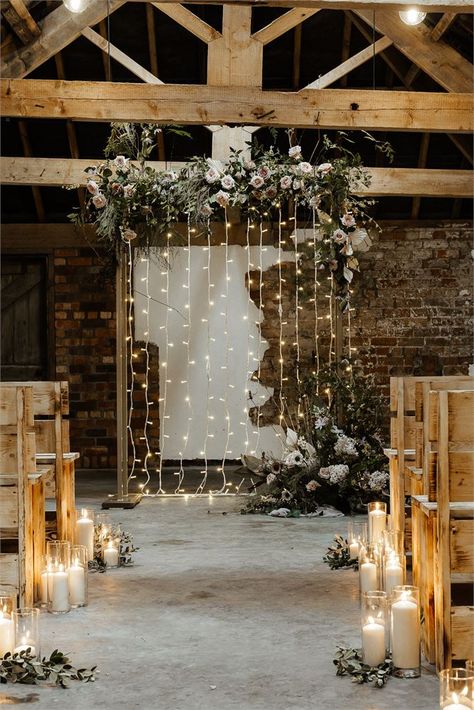 Rustic wedding heaven at Woolas Barn in Yorkshire! We loe the floral arch, fairy light backdrop, candle aisle decorations and rustic wooden benches for guests. Visit Hitched for lots more rustic wedding ideas at our favourite rustic venues. Fairy Light Backdrops, Aisle Candles, Rustic Wedding Decorations, Indoor Wedding Ceremonies, Wedding Ceremony Arch, Light Backdrop, Wedding Aisle Decorations, Rustic Wedding Venues, Ceremony Arch