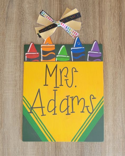 This colorful box of crayons would be so cute on your classroom door this year! Add your name or custom message to your class! Kindergarten Door Hanger, School Bus Door Hanger, Classroom Door Signs Teacher Name Diy, Pencil Door Hanger Teacher, Teachers Name Sign For Door, Shop Doors, Crayon Box, Wooden Door Hangers, Classroom Door