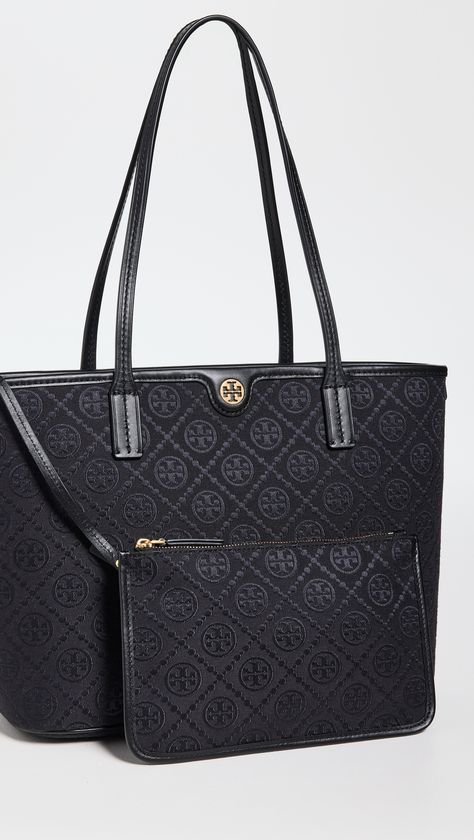 Find TORY BURCH T Monogram Small Zip Tote on Editorialist. Jacquard. Logo monogram pattern. Leather trim with contrast top stitching. Removable zip pouch. Zip closure. Zip interior pocket. Canvas backing. Weight: 17oz / 0.48kg. Imported, Cambodia. Measurements: Height: 9.75in / 25cm Length: 15.75in / 40cm Depth: 5.5in / 14cm Handle drop: 8.75in / 22cm T Monogram, Tory Burch Tote, Tory Burch Bag Totes, Chanel Perfume, Contrast Top, Monogram Pattern, Zip Tote, Monogram Bag, Tory Burch Bag