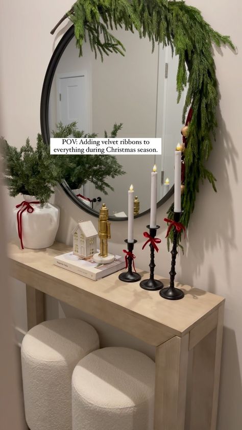 POV: Adding velvet ribbons to everything during Christmas 🎄🎁🥰 I don’t know about you but I’m obsessed adding ribbons everywhere… 🫶🏻🎄… | Instagram Christmas Bow On Mirror, Christmas Decoration Console Table, Entryway Ideas Christmas, Red Velvet Ribbon Christmas Decor, Console Table Decor Christmas, Christmas Console Table Decor Ideas, Console Table Christmas Decorating, Candle Christmas Decor, Christmas Themed Candles