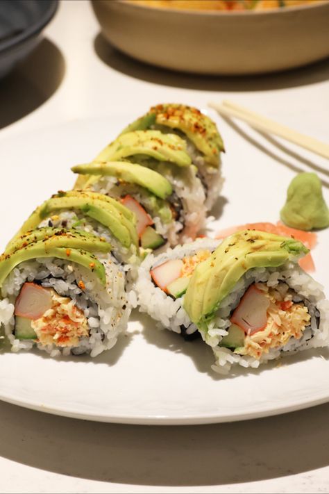 California Roll recipe. A classic sushi California roll with spicy mayo, crab meat, surimi, cucumber, avocado, and, cream cheese in a cut roll. Avocado And Cream Cheese, Sushi Crab, Sushi California Roll, Crab Sushi, Sushi Lunch, Meat Rolls, Cucumber Avocado, California Roll, Spicy Mayo