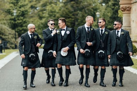 Subtle yet striking, how smart do Jamie and his groomsmen look in our original exclusive tartan Silver Mist? This is how you do contemporary wedding party dressing. Jamie stood out as groom with a pleated plaid, dapper bow tie and light dress sporran, while his wedding party wore tweed ties and black dress sporrans. It’s small details like these that make such a big impact. Feeling inspired to get the full squad kilted up on your big day? Make sure to take advantage of our exclusive wedding ... Green Kilt Wedding, Groomsmen Kilts, Kilts Wedding, Traditional Outfits For Men, Bridesmaids Green, Kilt Wedding, Black Kilt, Groomsmen Looks, Kilt Outfits