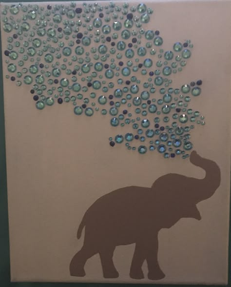 I got this idea from other pins I've seen. I made this for my sister. I painted the canvas light blue and used my cricut to help make an elephant stencil. I pieced together two different elephant silhouettes to create one I liked which I hand painted onto the canvas. The gems, glitter glue, paint, and canvas were all purchased at Walmart. Elephant Stencil, Balloons For Baby Shower, Glitter Paint For Walls, Elephant Crafts, Elephant Silhouette, Glitter Wall, Simple Canvas Paintings, Glitter Canvas, Glitter Art