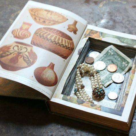 A hollowed-out book conceals small valuables and trinkets. Diy Hiding Places, Hidden Safe, Hollow Book, Decorating Bookshelves, Book Safe, Unique Gifts For Men, Decorating Coffee Tables, Book Making, Hardcover Book