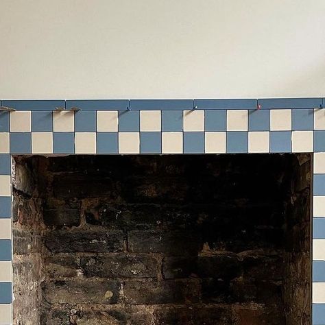 Bohome Interiors on Instagram: "Thank you @katy.takla for the mention in your post this week. Katy took inspiration from our fireplace at home and made it her own in her gorgeous bathroom. It’s lovely to see! We ended up putting a fire surround around ours, after a long debate about whether to keep without 🤍  The tiles are from @londonmosaic   We also used the red checkerboard in our dining room.   #fireplace #firesurround #sittingroomdecor #fireplacedecor  #interiorinspiration  #bohomeinteriors" Retile Fireplace, Fire Hearth Ideas, Tiles Fireplace Surround, Tiled Fireplace Surround, Fireplace Joinery, Tiles Fireplace, Kitchen Mantle, Fireplace Renovation, Tiled Fireplace