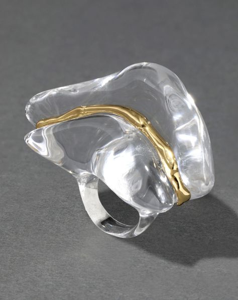 Crafted of hand-sculpted Lucite, this oversized futuristic cocktail ring reflects light from its organic liquid curvature. Accentuated by a molten 14k gold plated sliver slicing between its watery clear silhouette. Liquid Jewelry, 2024 Wardrobe, Clear Liquids, Acrylic Ring, Wave Ring, Stacked Bangles, Ring Sale, North South, Alexis Bittar