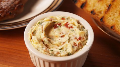 Tuscan Butter: 1 c. unsalted butter, softened to room temperature 4 sundried tomatoes, finely chopped 1/4 c. freshly grated Parmesan 2 tbsp. chopped basil 1 Large garlic clove, minced 2 tsp. salt Pepper DIRECTIONS  In a large bowl using a hand mixer, mix until butter has a whipped consistency. Combine all other ingredients in bowl and fold into butter. Transfer to a ramekin or small bowl and serve. Tuscan Butter, Flavored Butter Recipes, Compound Butters, Flavored Butters, Flavored Butter, Compound Butter, Dips And Spreads, Butter Recipes, Snacks Für Party