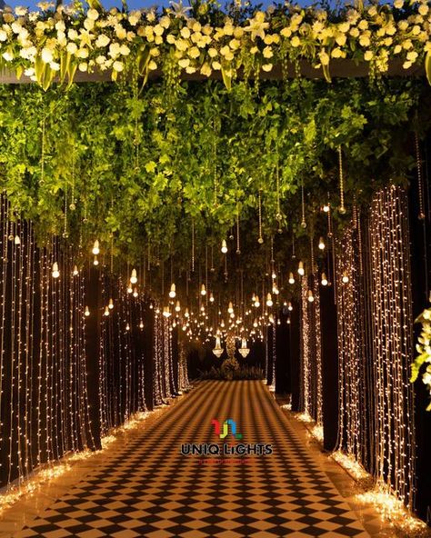 Naushad Khan on Instagram: "Taking our guests on a fairytale ✨ experience as they step into a pathway overflowing with hundreds of sparkly fairy-lights ✨✨✨✨✨ : : Light designing by: @uniq_lights : : Visit us: www.uniqlights.com : Facebook : Uniq lights You tube : Uniq lights Email@: info@uniqlights.com : : : : #wedding #bride #love #weddingphotography #uniqlights #weddingday #weddinginspiration #photography #fashion #weddingplanner #makeup #bridetobe #bridal #prewedding #weddingphotographer #w Light Decoration For Wedding, Lights Entrance Wedding, Lighted Pathway Wedding, Photobooth Ideas For Wedding Receptions, Lawn Stage Decoration, Fairy Lights Entrance Decor Wedding, Outside Indian Wedding, Bride Haldi Entry Ideas, Wedding Tunnel Entrance Fairy Lights