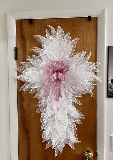 Dollar Tree Fanatics Crafts & Decor | Made another Easter Cross today | Facebook Diy Dollar Tree Cross Wreath, Cross Wreath Ideas, Dollar Tree Cross Wreath Ideas, Dollar Tree Cross Wreath Diy Christmas, Wire Cross Wreath Diy, Cross Wreath Deco Mesh, Diy Wire Cross Wreath Frame, Dollar Tree Wire Cross Wreath Diy, Cross Wreath Diy