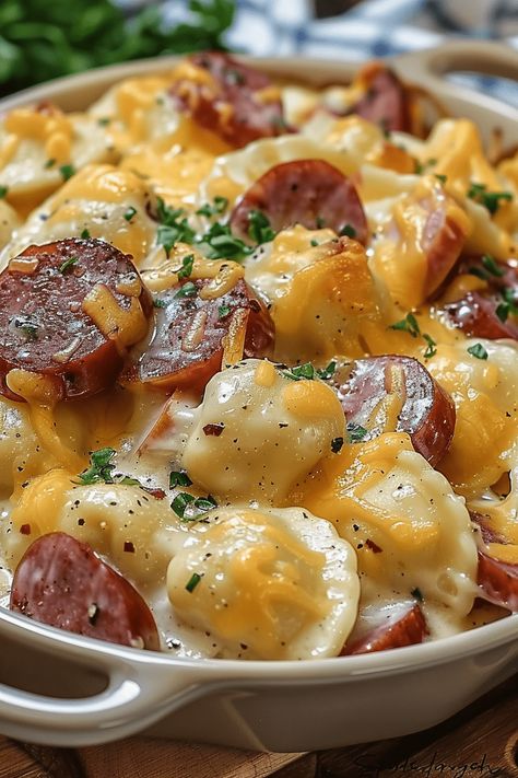 Pierogi Casserole Slow Cooker, One Pot Creamy Kielbasa Tortellini, Crockpot Sausage And Perogies, Mini Perogie Casserole, Piegories Casserole, Pierogi Dinner Ideas Crockpot, Keilbasa Perogie Crockpot, Crockpot Pierogi Kielbasa Casserole, Kelbasa And Perigees