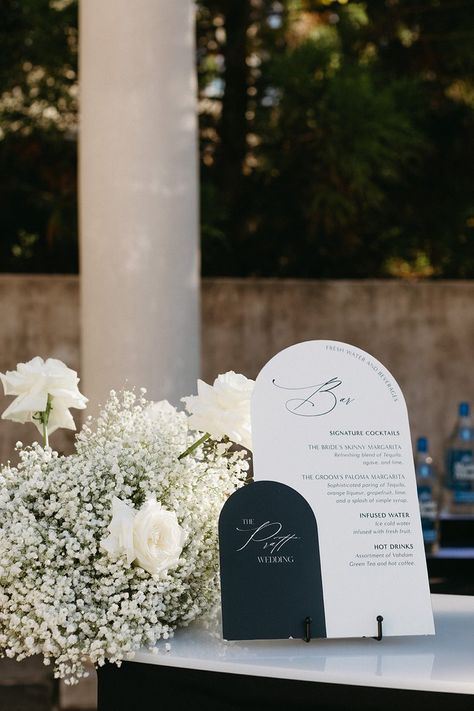 All White Wedding Flowers Receptions, Modern Black And White Wedding Signage, Bar Decor Wedding Receptions, Wedding Signs Bar, Monochromatic Wedding Flowers, Wedding Sign Florals, White Wedding With Black Accents, Bar Florals Wedding, Black And White Wedding Signs