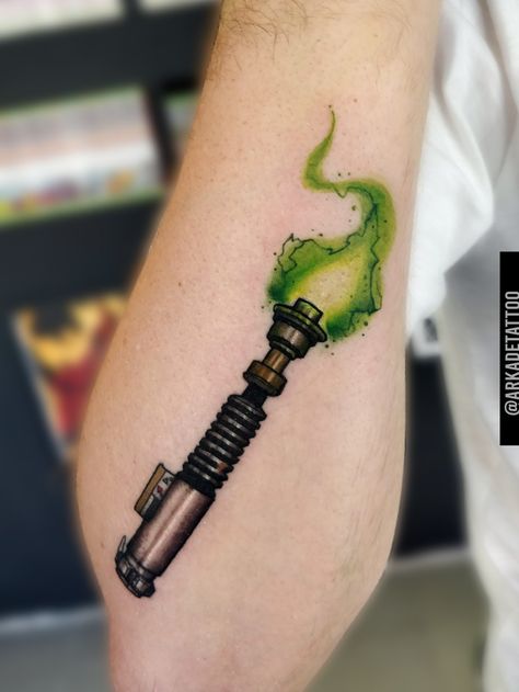 Yoda Lightsaber Tattoo, Luke Lightsaber Tattoo, Lightsaber Tattoo Design, Jedi Survivor Tattoo, Green Lightsaber Tattoo, Luke Skywalker Lightsaber Tattoo, Luke Skywalker Tattoo, Anakin Lightsaber Tattoo, Star Wars Lightsaber Tattoo