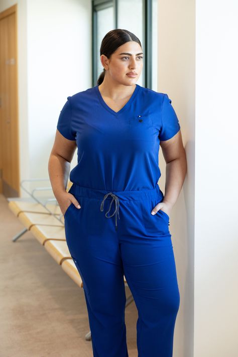 Koi Next Gen scrubs are made from a moisture-wicking, stretchy fabric that offers maximum comfort and flexibility. They provide a premium professional look while also having a relaxed and comfortable fit. Simple and stylish! The Ready to Work top features one chest pocket making it perfect for tucking, if that’s your style. Everyday Hero trousers feature a classic straight fit. They require no ironing, have a classic tailored shape and a comfortable drawstring waistband. Work Uniform, Everyday Heroes, Work Uniforms, Womens Scrubs, Work Tops, Professional Look, Scrub Tops, Drawstring Waistband, Stretchy Fabric