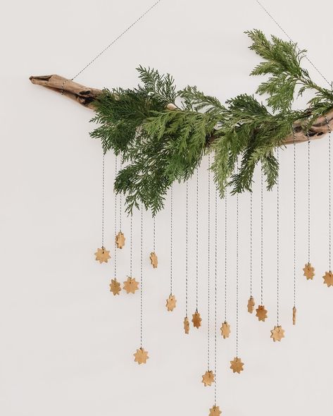 DIY whimsical star hanging ✨ it’s Day 3 in our week of easy Christmas DIY’s. Made with a foraged branch and cedar, twine, and baking soda clay. I’ve used it to add a bit of holiday magic to our playroom, but I think this would suit any living space.... We all need a little extra holiday magic this year right?! Want to give this DIY a try? I’m walking you through the tutorial today in stories, so hit the save button here then hop on over to stories to see how it comes toge Diy Christmas Hanging Decor, Hanging Xmas Decorations, Christmas Decorations On Wall, Xmas Room Decor Diy, Christmas Branch Decoration, Hanging Branch Christmas Decorations, Branch Christmas Decorations, How To Display Ornaments Without A Tree, Hanging Branch Decor