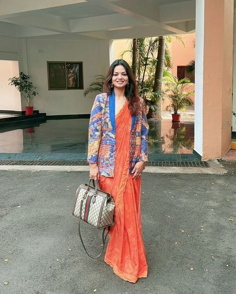 ⚜️ #SAUNDHTRIBE | The equation of power looks: 2 timeless silhouettes = 1 stand-out ensemble 🧡✨ @michelle_dominica wearing • Nargis Stitched Saree, paired with the blazer of the Aria Pantsuit #SaundhIndia #Saundh #EverydayLuxury #MadeInIndia #WomenInSaundh #stitchedsaree #womeninpower #SaundhSignature #printedblazer #powerblazer Product##https://saundh.com/collections/designer-sarees/products/nargis-stitched-saree-orange# Saree Blazer Look, Saree With Blazer, Saree Orange, Timeless Silhouettes, Stitched Saree, Printed Blazer, Designer Sarees, Everyday Luxuries, Indian Dresses