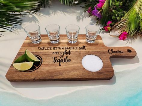 Elevate your tequila tasting experience with this stunning tequila flight board! Crafted from premium quality wood, this board features slots to securely hold four shot glasses, a recessed place for your salt and decorative area to have your limes for a stylish presentation of your favorite tequilas. Whether you're hosting a tasting party or looking to enjoy a variety of tequilas on your own, this flight board is the perfect accessory to add a touch of sophistication to your sipping sessions. Cheers to good times and great tequila with this exquisite tequila flight board! Proudly display in your kitchen, bar or any area that will make your friend jealous (easel stand not included) . Each board is hand finished with food safe mineral oil to enhance the beautiful wood grain. The reverse side Tequila Wood Board, Drink Flight Boards, Tequila Board, Tasting Tray, Flight Board, Tequila Tasting, Palette Projects, Tequila Shots, Easel Stand