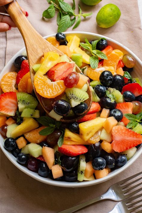 Celebrate Easter with a splash of color and a burst of flavor with this Easter Fruit Salad! Filled with juicy cantaloupe, sweet melons, and a variety of berries, all topped with a honey-lime-mint dressing. It's the perfect healthy addition to your holiday feast, suitable for vegetarians and gluten-free diets. It's a versatile dish that is ideal as a side, dessert, or pancake topping. Click to learn how to make Easter Fruit Salad!! #EasterFruitSalad #HealthyEating #FruitSaladRecipes #... Mint Fruit Salad, Easter Fruit Salad, Apricot Marmalade, Easter Salad, Quick Brunch, Mint Dressing, Easter Fruit, Dash Recipe, Pancake Toppings