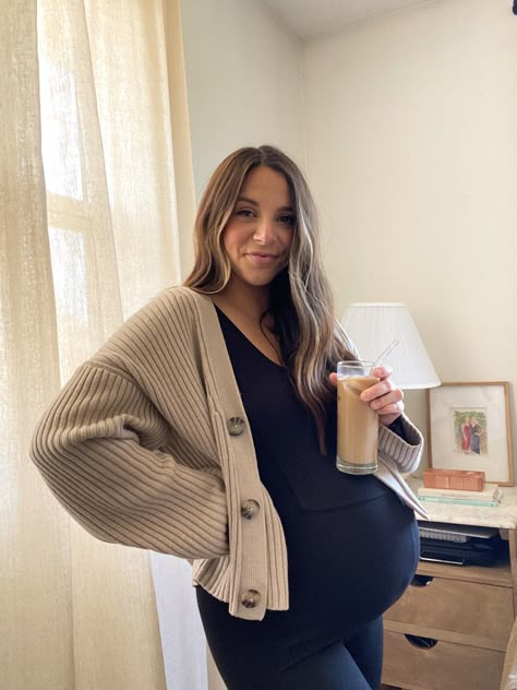 Maternity outfit ideas, pregnancy fashion, iced coffee at home Bump Fall Outfits, Maternity One Piece Jumpsuit, Button Up Maternity Outfit, Maturity Fall Outfits, Cardigan Maternity Outfits, Pregnant Hairstylist Outfit, Ob Appointment Outfit, Pregnant Cardigan Outfit, Maternity Unitard Outfit