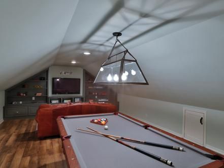 Attic Game Room, Game Room With Pool Table, Wood Paneling Makeover, Magnolia Style, Paneling Makeover, Chip Gaines, Built In Entertainment Center, Hgtv Fixer Upper, Attic Space