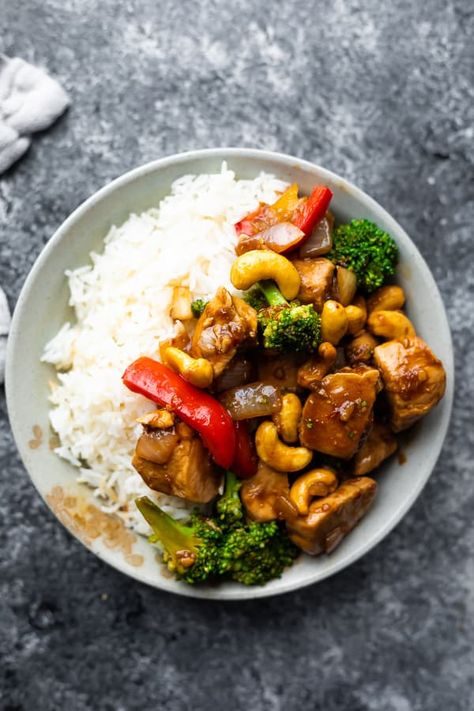 An easy 30-minute recipe for maple ginger cashew chicken stir fry! Packed full of vegetables and tossed in a sweet and savory maple ginger sauce.