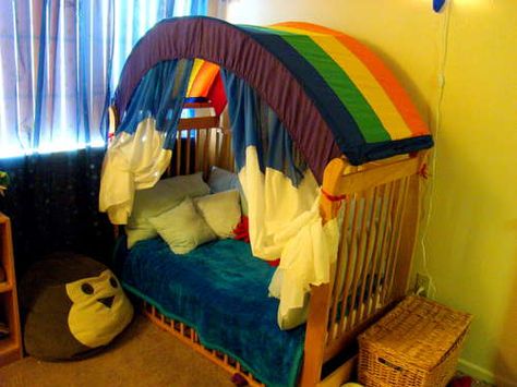 Make a Rainbow Canopy for Your Child's Room - this is one of mine, but I love it so much. My little guy is six now and has outgrown his, but he loved it. The rainbow cover is now half a duvet cover. Rainbow Canopy, Closet Attic, Crib Tent, Diy Kids Tent, Ideas Habitaciones, Rainbow Bedroom, Ikea Kura Bed, Kura Bed, Kids Canopy