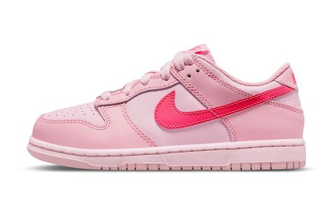 Nike’s Dunk Low is no exception to the trend of pastel-colored sneakers as Easter approaches. When it first debuted earlier this year, the Nike Dunk Low “Triple Pink” was a refreshing change of pace. Nike’s simple color scheme complements Peter Moore’s iconic design, which features a variety of pink shades, most of which are pastels. Hyper pink dominates the Swooshes and brand marks, with lighter shades appearing on the overlays, liners, upper, and sole unit as you move lower i Nike Dunk Low Triple Pink, Dunks Nike, Pink Nikes, Swag Shoes, Nike Kids, Shades Of Pink, Nike Dunk Low, Nike Cortez Sneaker, Dunk Low