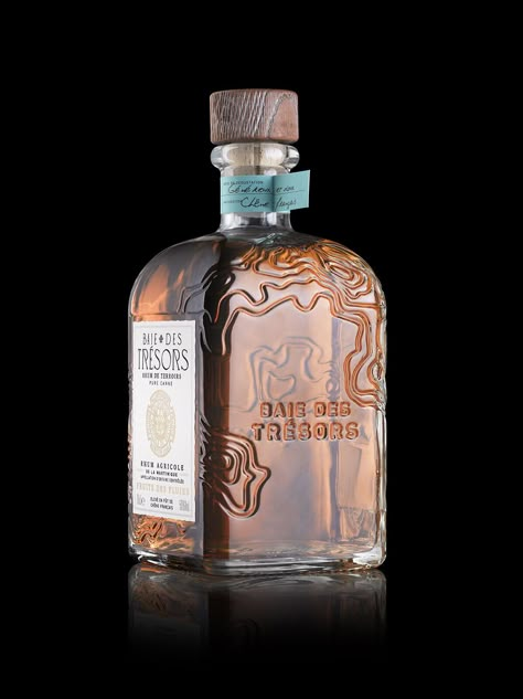 Stranger & Stranger's Intricate Bottle Design For Baie Des Trésors | Dieline - Design, Branding & Packaging Inspiration Spirits Packaging Design, Alcohol Packaging Design, Whiskey Packaging, Wine Bottle Design, Whiskey Brands, Rum Bottle, Bottle Design Packaging, Alcohol Packaging, Perfume Bottle Design