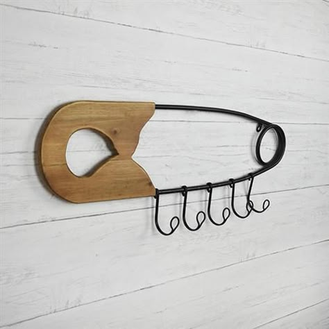 Safety Pin Wall Hanging with Hooks 28" L $ 24.95 Large safety pin wall hanging with five hooks. Great for sewing room, baby and kids rooms.  Size: 28" L x 10" H x 2.5" D Material: Metal, Wood Pin Wall, Rustic Accessories, Large Safety Pin, Clothing Store Displays, Clothing Store Interior, Store Design Boutique, Sewing Room Design, Sewing Room Decor, Furniture Rustic