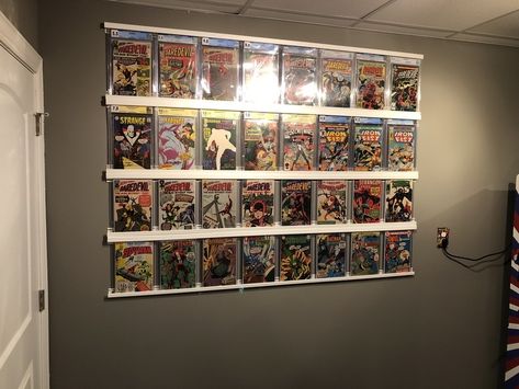 The OP of this just says he used "J channel" - Studio45 would like you to know that is a home improvement supply used in the installation of vinyl siding Comic Wall, Comic Book Display, Comic Room, Comic Book Storage, Nerd Decor, Book Display Shelf, Room Work, Game Room Basement, Book Wall Art