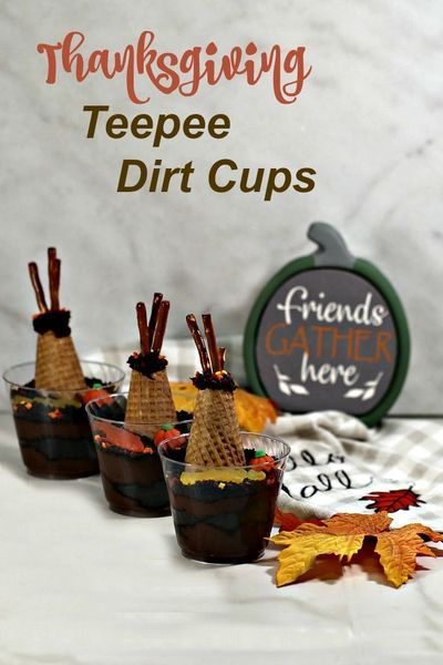 Three dirt desert cups with pumpkin and fall leaves. These Thanksgiving dirt are a fun way to teach your child a little about nomadic Native American tribes and give them a tasty snack at the same time. #thanksgiving #dirtcups #teepees #funwithfood Thanksgiving Dirt Pudding, Thanksgiving Pudding Cups, Thanksgiving Pudding, Dirt Cup Recipe, Dirt Cups Dessert, Dirt Desert, Dirt Cups Recipe, Dirt Pudding Cups, Pudding Cup Recipes