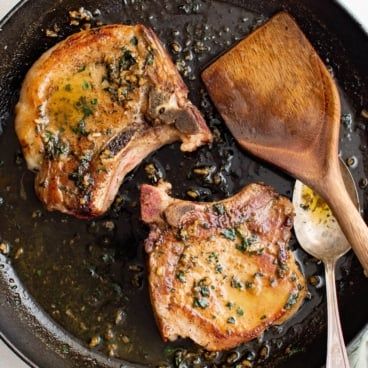 Iron Skillet Pork Chops, Skillet Pork Chop Recipes, Skillet Pork Chops, Lemon Caper Sauce, Seared Pork Chops, Pork Chop Dinner, Pan Seared Scallops, The Recipe Critic, Juicy Pork Chops