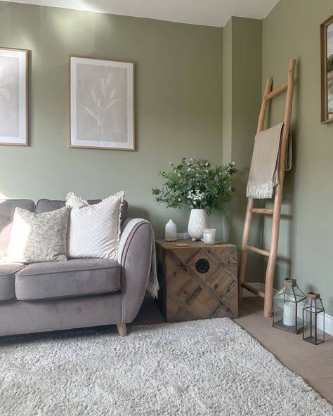 Snug room details ✨ This was one of the first rooms we finished after moving in and I’m so glad I went for the green walls! As well as my favourite cup of tea spot, it’s turned into my favourite book reading spot too 🥰😂 Walls: @duluxuk overtly olive Sofa: @scssofas (ad) Trunk: bought secondhand but have seen it on @cotswoldluxecc Ladder/throw: @homesense_uk Prints: @desenio Bouquet/lanterns: @thewhitecompany Diffuser: @marmaladeoflondon Cushions: @dusk.com / @mylittleforesthome Ha... May Happy New Month, Sunshine Strawberries, Basil Pot, Overtly Olive, Living Room Downstairs, Olive Living Rooms, Wooden Floors Living Room, Green Walls Living Room, Olive Sofa