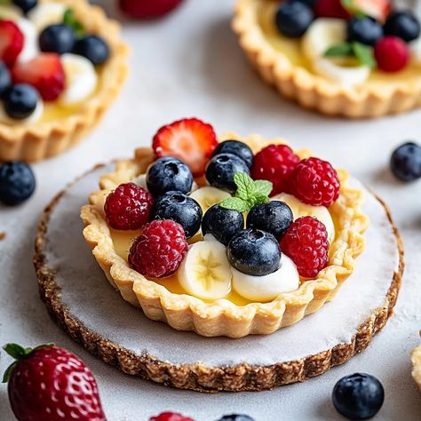 Easy Mini Fruit Tarts Recipe for Any Occasion Fruit Tarts Mini, Mini Fruit Tart Recipe, Fruit Tarts Recipe, French Fruit Tart, Fruit Custard Tart, Fruit Tart Recipe Mini, Fruit Flan, Fancy Foods, Mini Fruit Tarts