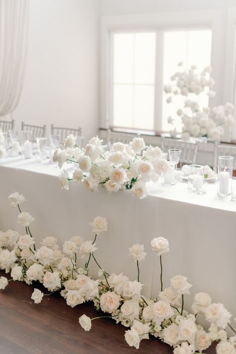 Modern White Sweetheart Table, White Flower Head Table, Elegant White Floral Arrangements, White Flower Sweetheart Table, Wedding Floral Runner, White Rose Floral Arrangements, Wedding Head Table Florals, Modern White Floral Arrangements, White Roses Sweetheart Table