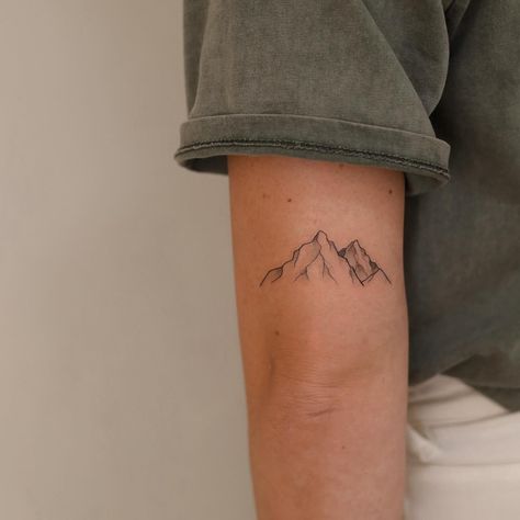 Mountains 🏔️ I also do small tattoos sometimes, and I especially love nature themed ones❤️ This one was for Eline and has a special meaning, thanks Eline! Check out her music as well! @eline.music . . . . . #mountainstattoo #mountaintattoo #naturetattoo #finelinetattoo #zwolletattoo #tattoozwolle Mountain Elbow Tattoo, Dainty Mountain Tattoo Simple, Sibling Mountain Tattoos, Alaskan Mountain Tattoo, Small Tattoo Mountain, Tattoo Mountains Minimalist, Mountains With Flowers Tattoo, Nature Tattoos Minimalist, Washington State Tattoo Ideas