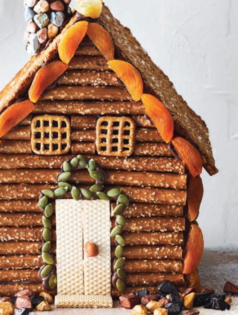 Log Cabin Pretzel House, Charcuterie Log Cabin, Pretzel House Log Cabins, Pretzel Log Cabin Christmas, Charcuterie Cabin, Log Cabin Gingerbread House Ideas, Pretzel House, Pretzel Log Cabin, Gingerbread Log Cabin