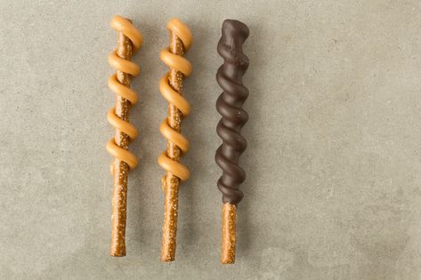 Caramel Twist Pretzel Rods — Orson Gygi Blog Chocolate Caramel Pretzels Rods, Caramel Pretzels Rods, Chocolate Pretzel Rods, Chocolate Dipped Pretzel Rods, Dipped Pretzel Rods, Chocolate Caramel Pretzels, Chocolate Covered Pretzel Rods, Chocolate Dipped Pretzels, Caramel Pretzels