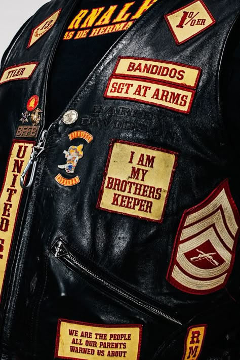 In Chapter 1, Butch Cobb comes home and takes off a leather cut much like this one, with patches signifying his chapter, his position as club prez, and his accomplishments. Gang Jacket, Bandidos Motorcycle Club, Gang Color, Biker Gangs, Bike Gang, Motorcycle Patches, Motorcycle Gang, Biker Wear, Leather Jacket Men Style