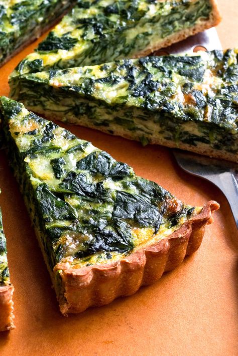 NYT Cooking: This is a classic combination for a quiche, but it’s lighter, with <a href="http://cooking.nytimes.com/recipes/1016715-whole-wheat-yeasted-olive-oil-pastry">a whole-wheat and olive oil crust</a>. If you don't have the time to make the crust, store bought will work just fine. Pizza Roll, Plats Healthy, Onion Tart, Spinach Pie, Fine Cooking, Savory Tart, Tart Recipe, Nyt Cooking, Recipes Crockpot