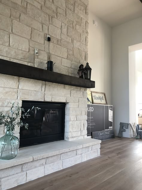 Light Grey Stone Fireplace, Wide Stone Fireplace, Stone Fireplace With Black Mantle, White Stone Fireplace Black Mantle, Gas Fireplace With Hearth, Light Fireplace Stone, Farmhouse Rock Fireplace, Fireplace White Stone, Gray Ledgestone Fireplace